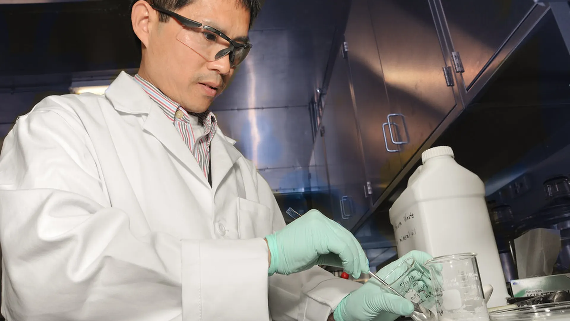 Researcher reviewing data in a lab setting